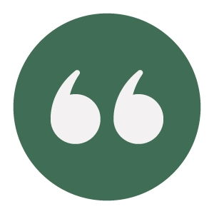 A green circle with a white, stylized quotation mark symbol inside.